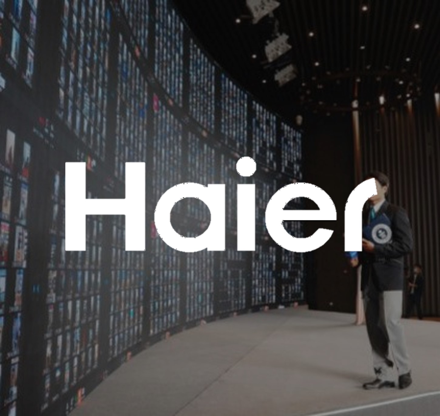 adjudicator standing in front of big screen