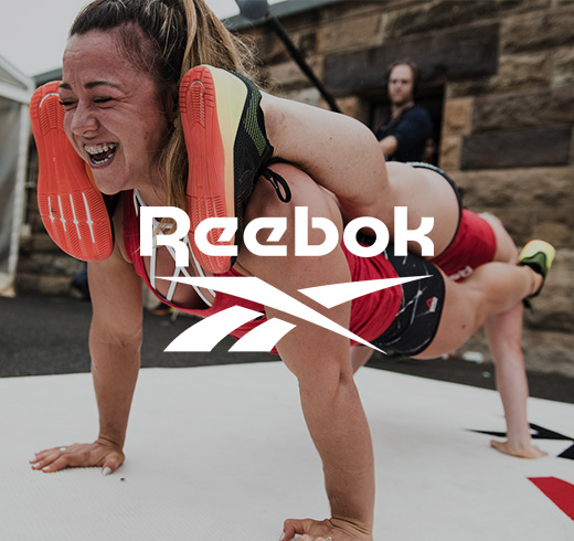 Woman doing a plank on top of another woman doing a plank